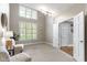 Inviting sitting room features soaring ceilings, large windows and neutral tones at 10919 Running Tide Ct, Indianapolis, IN 46236