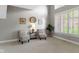 Inviting sitting room featuring soaring ceilings, large windows and neutral tones at 10919 Running Tide Ct, Indianapolis, IN 46236