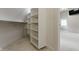 Custom walk-in closet with built-in shelving and ample storage space at 10919 Running Tide Ct, Indianapolis, IN 46236