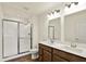 Bright bathroom featuring double vanity, shower, and modern fixtures at 110 Maxim Ct, Cumberland, IN 46229