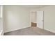 Neutral bedroom with carpeted floors and white door leading to another room at 110 Maxim Ct, Cumberland, IN 46229