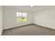 Carpeted bedroom with natural light from a window with neighborhood views at 110 Maxim Ct, Cumberland, IN 46229