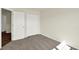 Neutral-colored bedroom with carpet, closet with white doors, and a view to hallway at 110 Maxim Ct, Cumberland, IN 46229