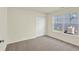 Carpeted bedroom with natural light, featuring a large closet and window with exterior view at 110 Maxim Ct, Cumberland, IN 46229