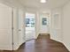 Inviting entryway with hardwood floors and natural light, leading to the main living areas of the home at 110 Maxim Ct, Cumberland, IN 46229