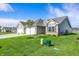 Beautifully landscaped home with a well-maintained lawn, a two-car garage, and a serene neighborhood setting at 110 Maxim Ct, Cumberland, IN 46229