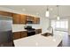 Contemporary kitchen with stainless steel appliances, a center island, and hardwood floors for a sleek design at 110 Maxim Ct, Cumberland, IN 46229