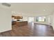 Modern kitchen featuring a large island, stainless steel appliances, and an open layout to the living area at 110 Maxim Ct, Cumberland, IN 46229