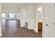 Open-concept living space with hardwood flooring and large windows providing ample natural light at 110 Maxim Ct, Cumberland, IN 46229