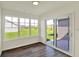 Bright sunroom with sliding glass door and large windows overlooking the backyard at 110 Maxim Ct, Cumberland, IN 46229