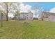 Spacious backyard features a well-maintained lawn and deck, great for outdoor activities at 11212 Bayridge E Cir, Indianapolis, IN 46236