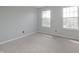 Bedroom with carpet flooring and two windows providing natural light at 11212 Bayridge E Cir, Indianapolis, IN 46236