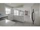 Bright kitchen features white cabinets, an island, stainless steel appliances, and a blue backsplash at 11212 Bayridge E Cir, Indianapolis, IN 46236