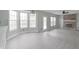 Open-concept living room features a brick fireplace, a ceiling fan, and neutral paint at 11212 Bayridge E Cir, Indianapolis, IN 46236