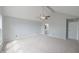 Spacious main bedroom with carpet, ceiling fan, neutral colors, and attached bathroom at 11212 Bayridge E Cir, Indianapolis, IN 46236