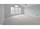 Vaulted main bedroom featuring carpet flooring, ceiling fan, and plenty of natural light at 11212 Bayridge E Cir, Indianapolis, IN 46236