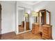 Bright bedroom features mirrored closet and vintage vanity with ample storage space at 1127 Jody Ct, Greenwood, IN 46143