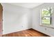 Cozy bedroom with natural light from the window and stylish wood laminate flooring at 1127 Jody Ct, Greenwood, IN 46143