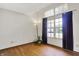 An empty room that features an exterior window, laminate floors, and a modern lamp at 1127 Jody Ct, Greenwood, IN 46143