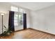 An empty room that features an exterior window and laminate floors at 1127 Jody Ct, Greenwood, IN 46143