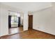 An empty room that features a mirrored closet, an exterior window, and laminate floors at 1127 Jody Ct, Greenwood, IN 46143
