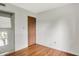 Bedroom featuring wood floors, closet and wood door at 1127 Jody Ct, Greenwood, IN 46143