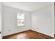 Cozy bedroom with natural light from the window and stylish wood laminate flooring at 1127 Jody Ct, Greenwood, IN 46143