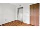 Bright bedroom features mirrored closet and wood floors, offering functionality and style at 1127 Jody Ct, Greenwood, IN 46143