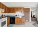 Traditional eat-in kitchen features ample countertop space and leads to a living space at 1127 Jody Ct, Greenwood, IN 46143