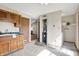 A kitchen and utility room featuring cabinetry, a sink, a door, and a washing machine at 1127 Jody Ct, Greenwood, IN 46143