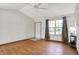 Bright living room featuring wood-look flooring, a ceiling fan, and natural light at 1127 Jody Ct, Greenwood, IN 46143