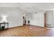 Bright living room with wood-look floors, ceiling fan, and natural light at 1127 Jody Ct, Greenwood, IN 46143