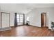 Bright living room featuring wood-look flooring, a ceiling fan, and natural light at 1127 Jody Ct, Greenwood, IN 46143