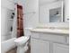 Functional bathroom featuring shower, toilet, vanity with countertop, and a mirror at 11327 Cuyahoga Dr, Indianapolis, IN 46235