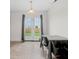 Dining area with French doors, neutral walls, and simple light fixture at 11327 Cuyahoga Dr, Indianapolis, IN 46235