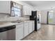 Bright kitchen with stainless steel appliances and neutral countertops at 11327 Cuyahoga Dr, Indianapolis, IN 46235