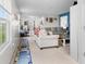 Bright living room featuring neutral paint, comfortable seating, and ample natural light from large windows at 11327 Cuyahoga Dr, Indianapolis, IN 46235