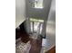 Two-story foyer with a view of the front door, staircase, and hardwood floors, creating a welcoming entrance at 12353 Brean Way, Fishers, IN 46037