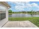 Lush backyard featuring serene pond views and a fountain feature creating a relaxing atmosphere at 12698 Whisper Way, Fishers, IN 46037