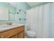 Bathroom featuring light blue walls, a wood vanity, and a shower and tub combination at 12698 Whisper Way, Fishers, IN 46037