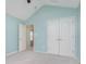 Bedroom featuring a vaulted ceiling, ceiling fan, double door closet, and an open doorway at 12698 Whisper Way, Fishers, IN 46037