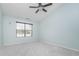 Neutral bedroom with plush carpet and ample natural light from a large window at 12698 Whisper Way, Fishers, IN 46037