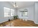 Inviting living area with hardwood floors, natural light, and a view to another room at 12698 Whisper Way, Fishers, IN 46037
