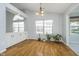 Light-filled room with hardwood floors, built-in cabinets, and views of the outdoors at 12698 Whisper Way, Fishers, IN 46037