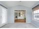 Bright sunroom featuring a ceiling fan and view to another room at 12698 Whisper Way, Fishers, IN 46037