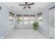 Cozy sun room with multiple windows showcasing lake views at 12698 Whisper Way, Fishers, IN 46037