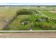 Aerial view showcasing the property's location amidst a picturesque landscape with neighboring homes and open fields at 1285 S 1100 E, Zionsville, IN 46077