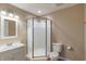 Bright bathroom featuring a corner shower, vanity with a sink, and a toilet at 1285 S 1100 E, Zionsville, IN 46077