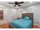 Inviting bedroom with wood-look floors, fan, and ample lighting, creating a warm atmosphere at 1285 S 1100 E, Zionsville, IN 46077