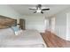 Bright bedroom with a modern platform bed, ceiling fan, and plenty of natural light at 1285 S 1100 E, Zionsville, IN 46077